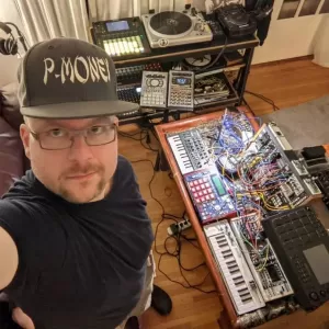 Photograph of Patrick in front of studio equipment